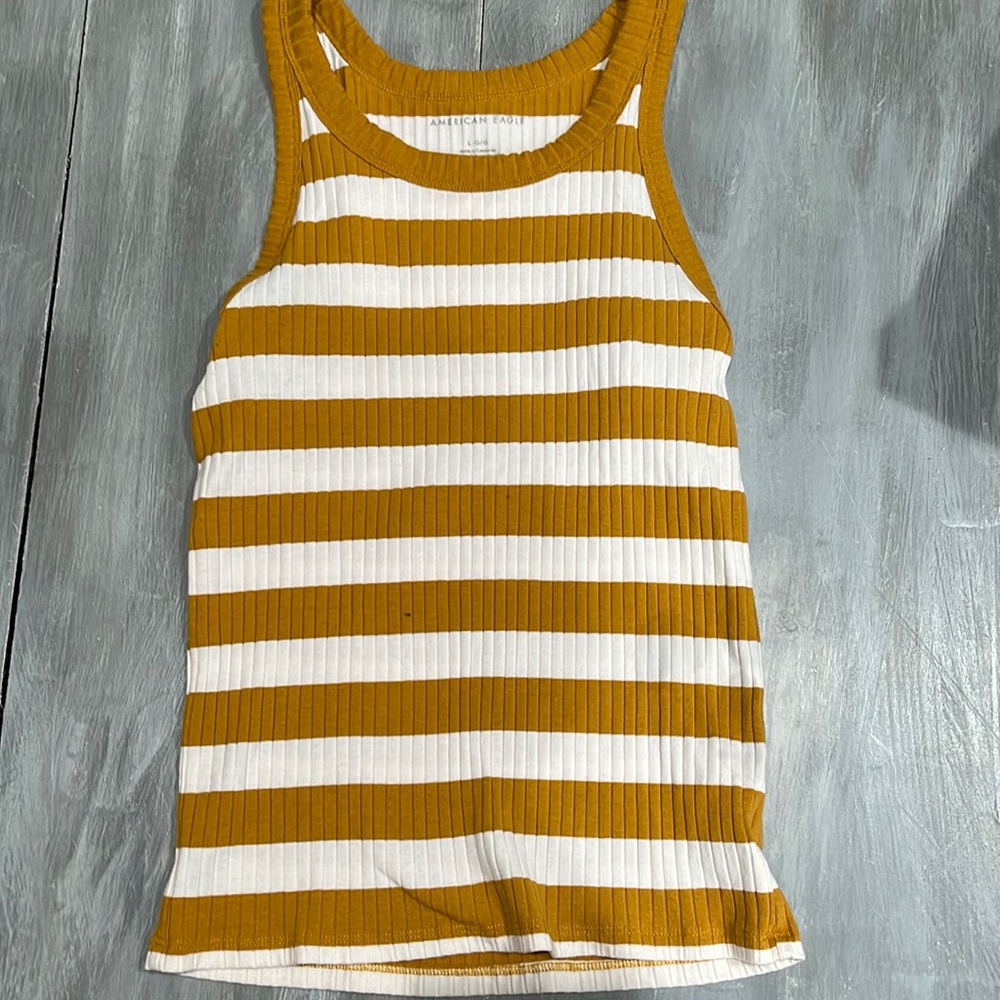 mustard yellow and white stripped American Eagle tank top.